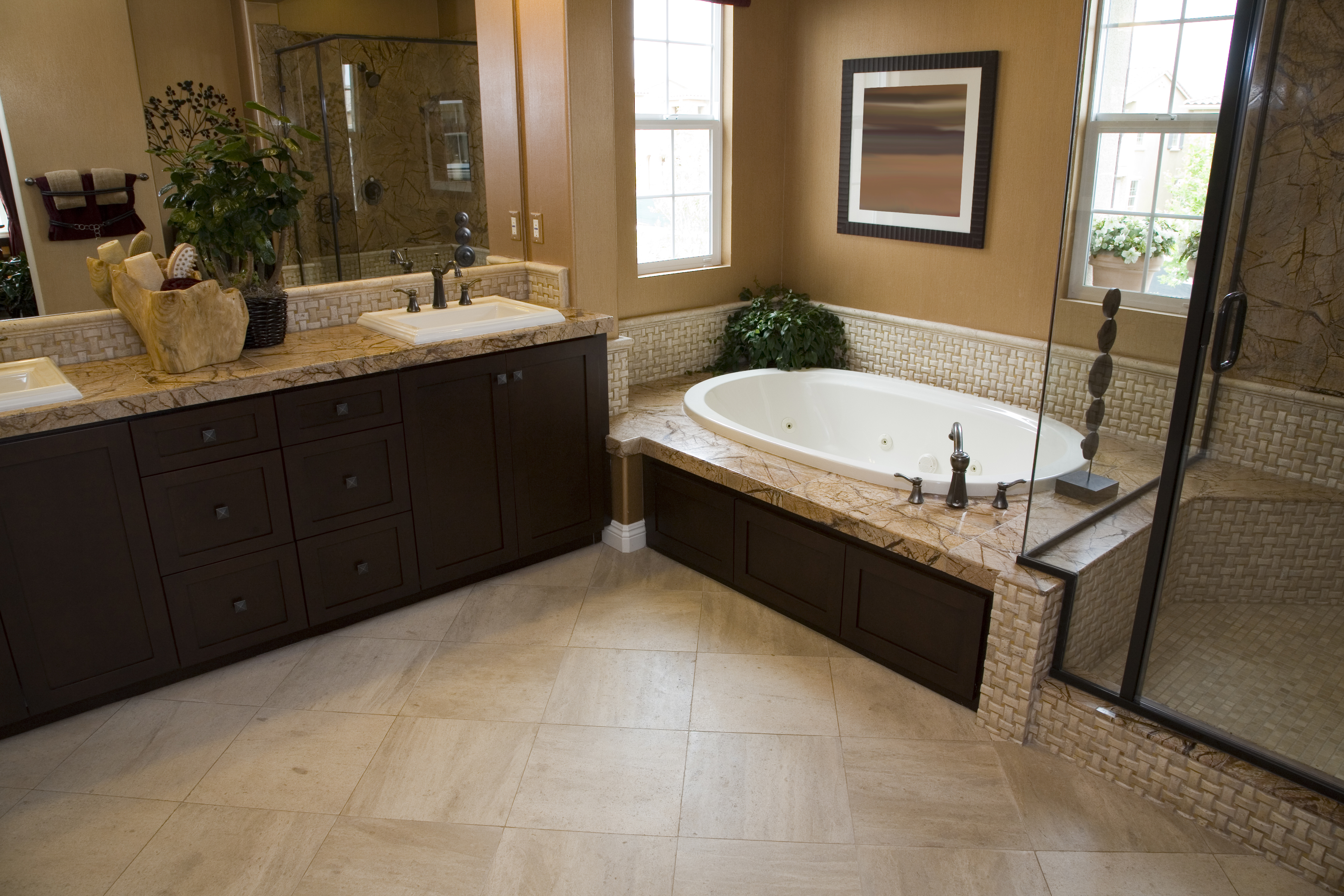 Luxury Vinyl Tile installed within a residential bathroom with a shower and bathtub 