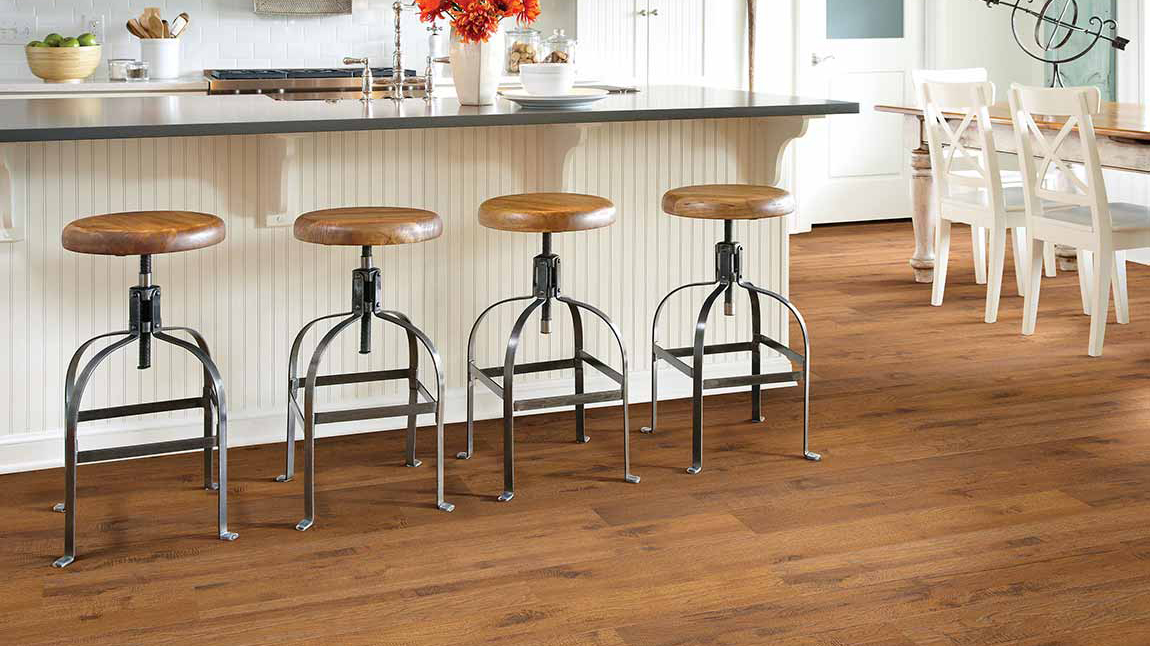 Laminate flooring in a kitchen, installation services available.