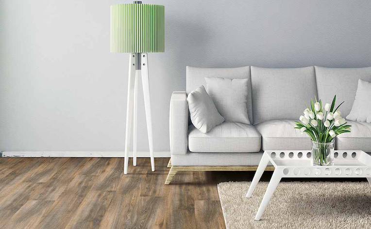 Living room with neutral grey paint and luxury vinyl plank flooring with a clean interior design